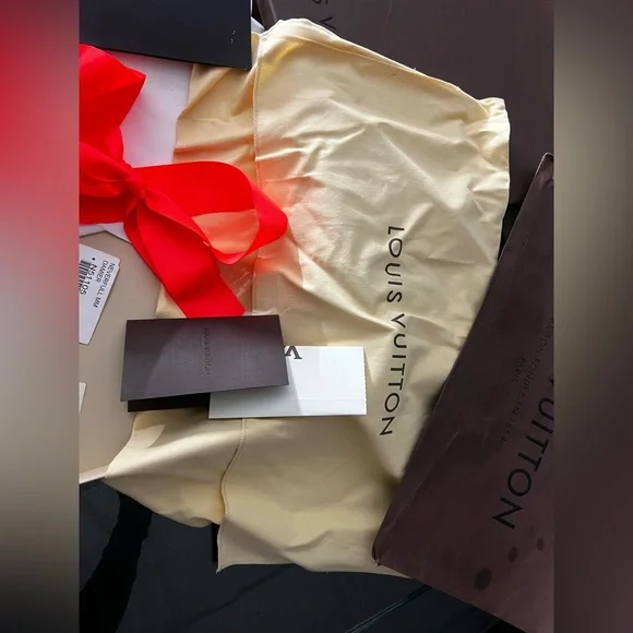 Louis Vuitton Dark Brown Box with Vibrant Red Ribbon